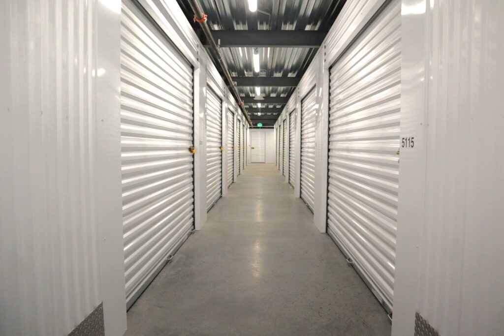 Bright hallway with storage units on the left and right.