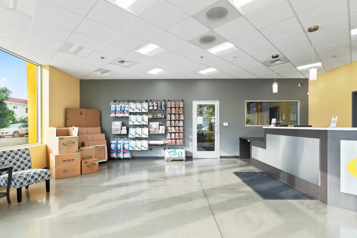 Storage boxes and household items neatly organized in a room at U-Stor-It.